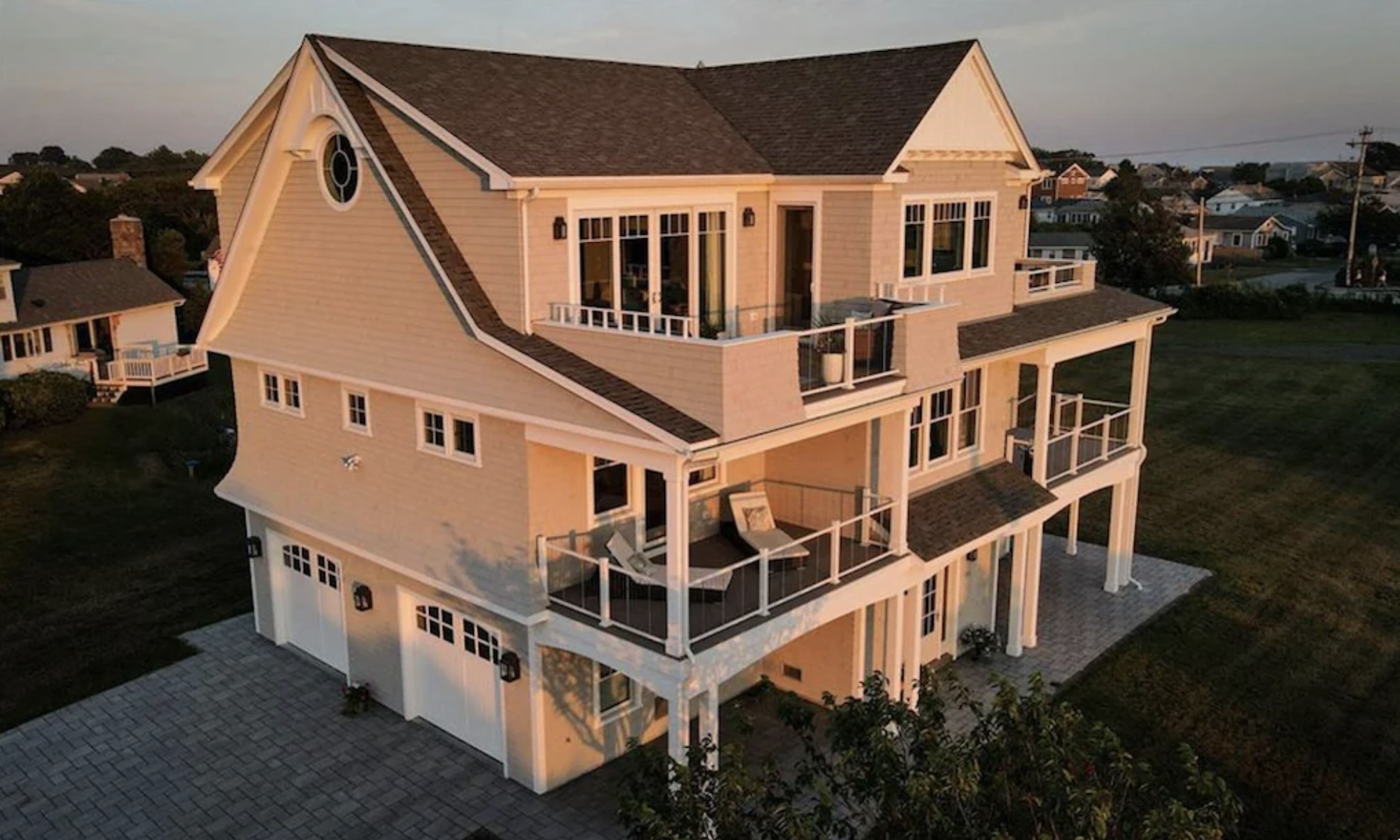Rhode Island coastal estate aerial view at sunset